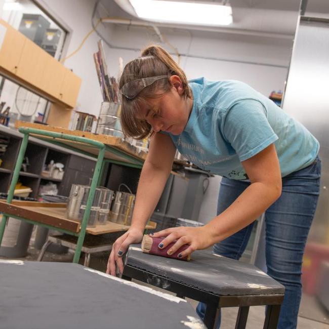 Student working in the scene shop at the Pablo Center